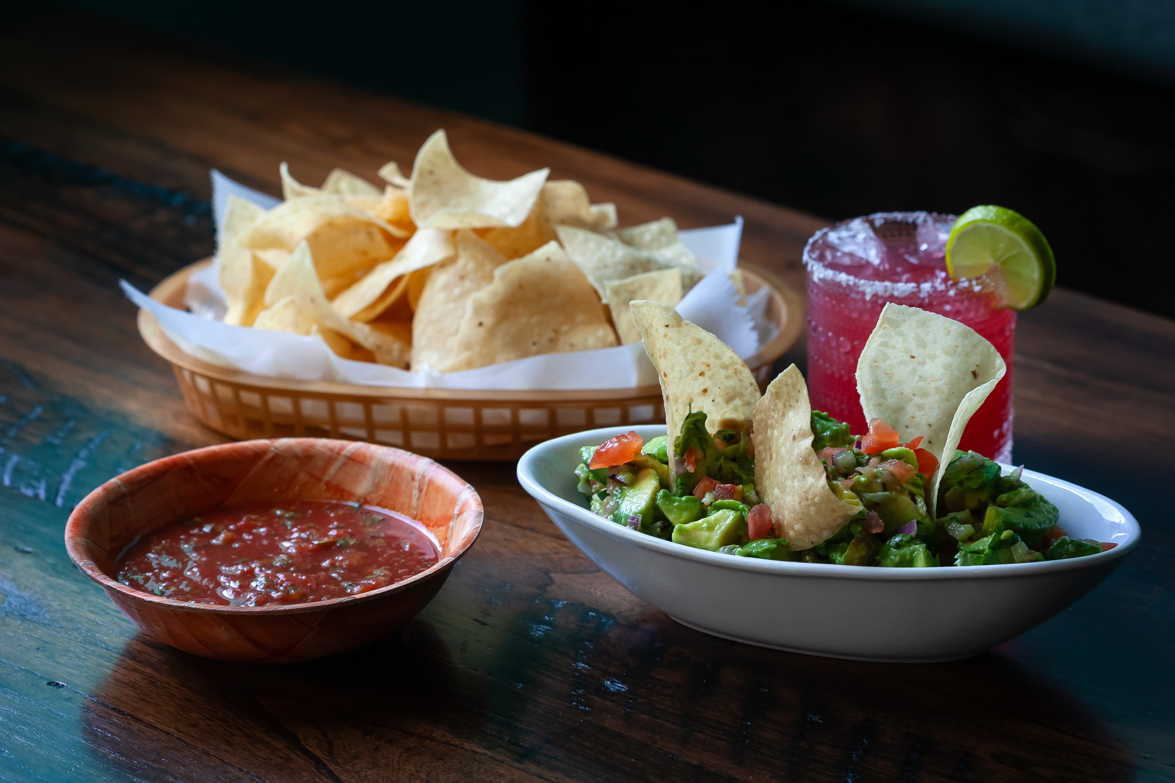 Chips and salsa with Holy Guacamole and a margarita