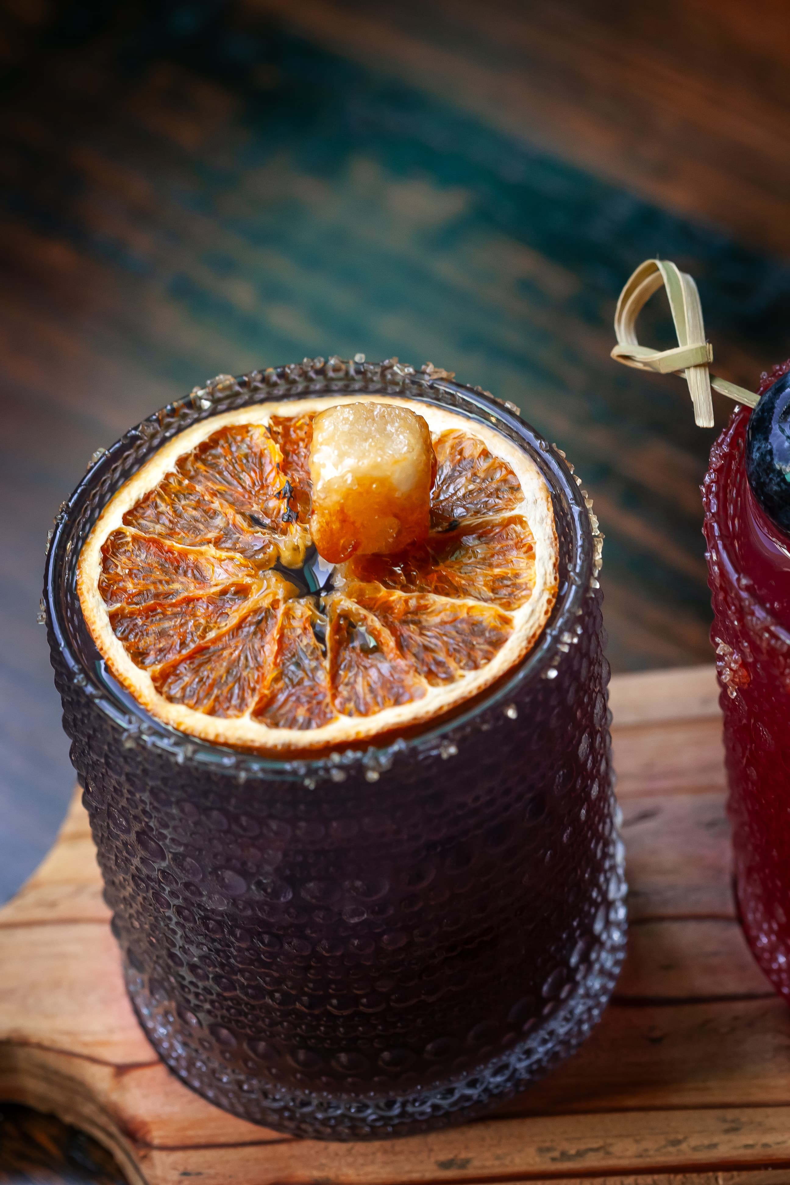 Cocktail with dried orange garnish