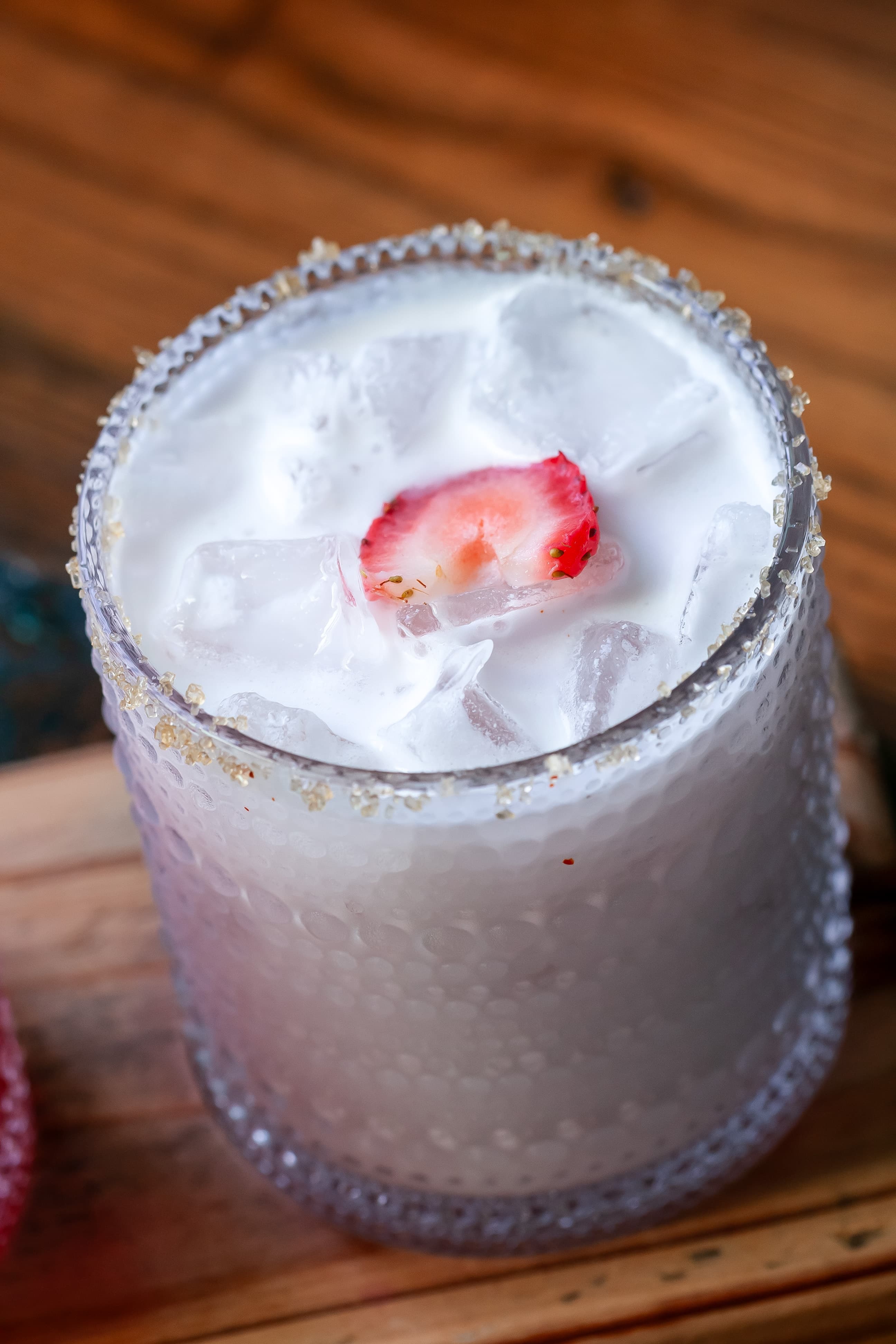 Coconut cocktail with strawberry garnish